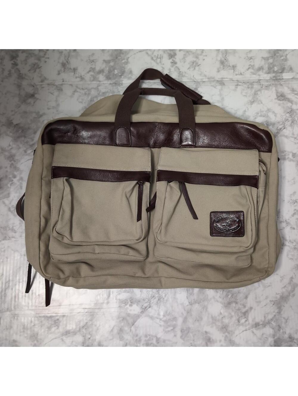 VINTAGE WINCHESTER GUNS AND AMMUNITION GREEN CANVAS AND LEATHER MESSENGER BAG